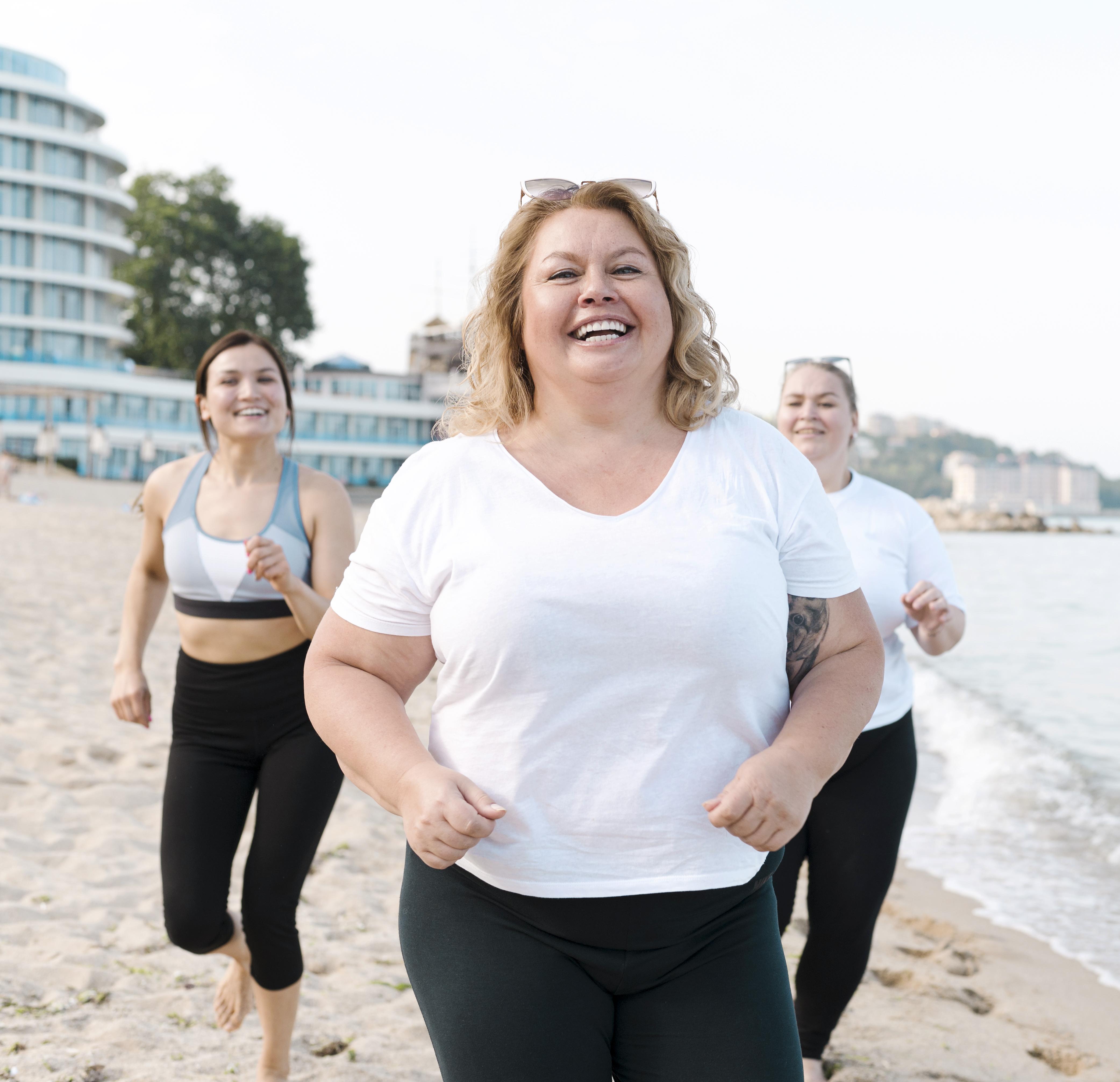 excited-young-friends-running-beach